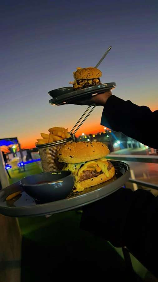 Two burger trays — cheesy sunset
