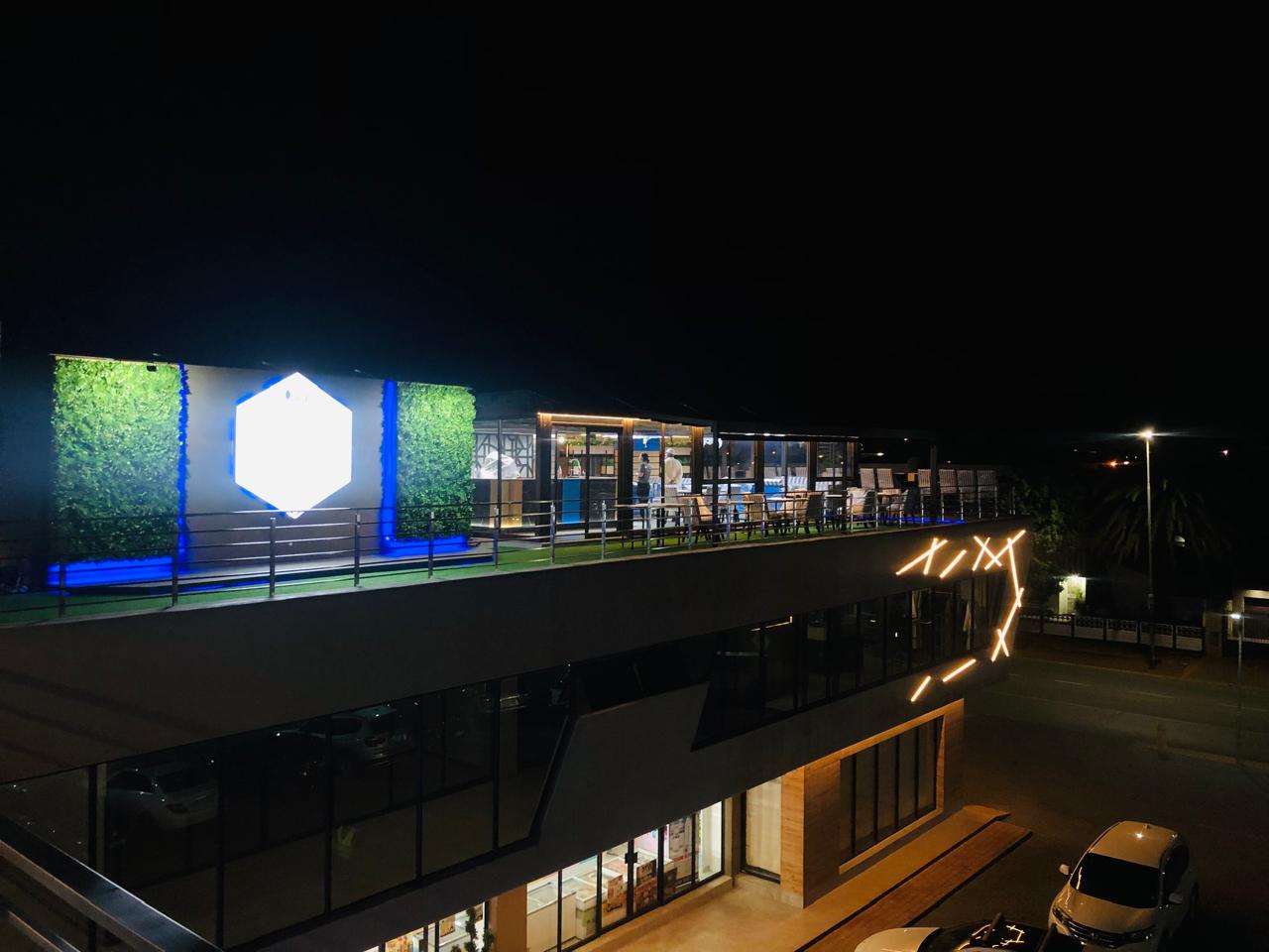 Rooftop at night — neon blue