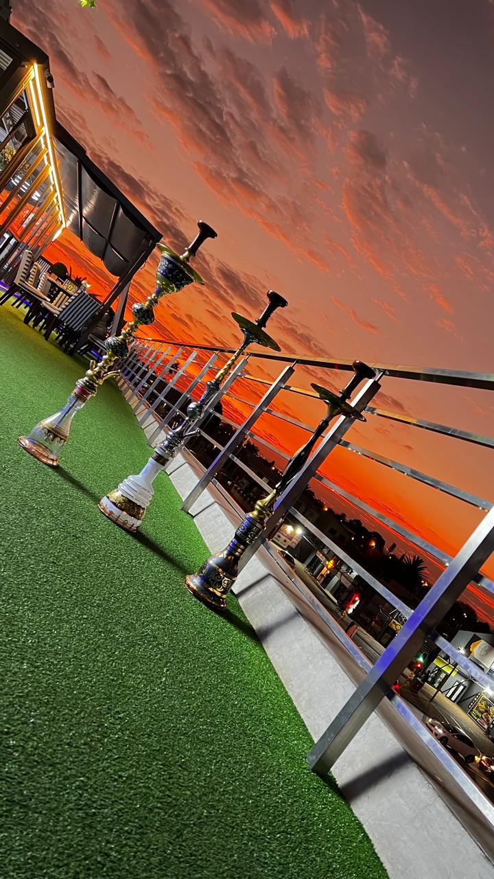 Sheesha pipes against orange sky