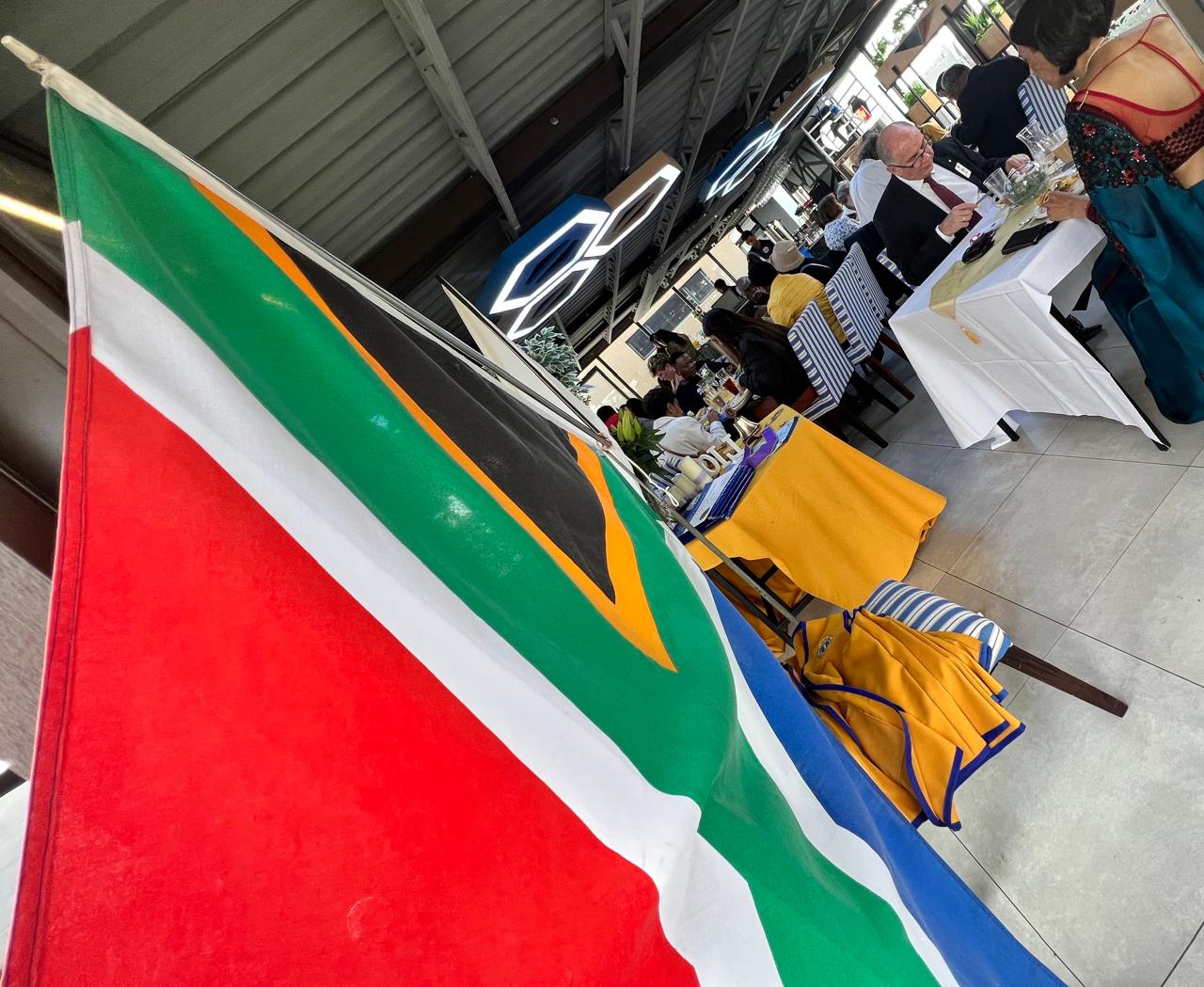 SA flag with guests — formal event