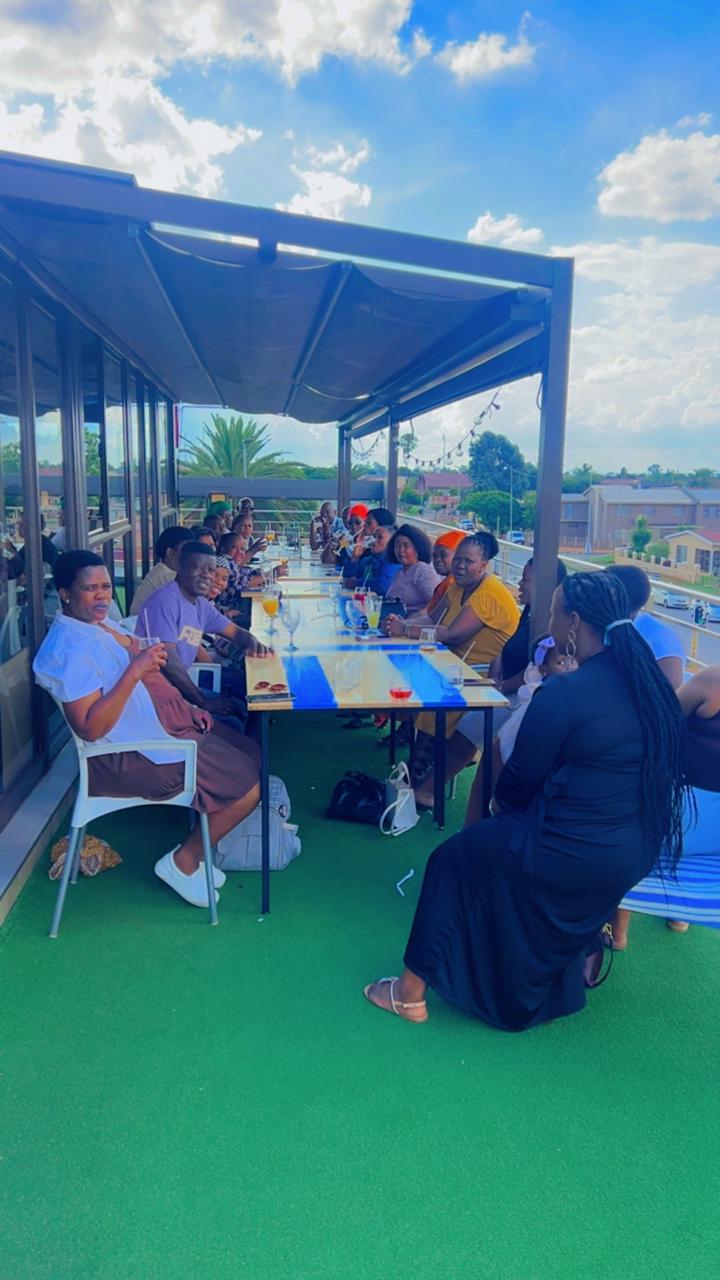 Large group dining on rooftop
