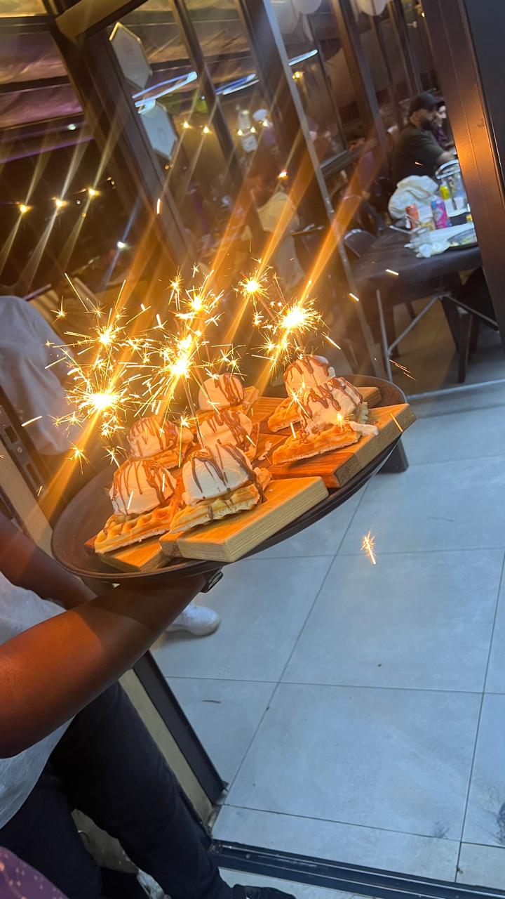 Waffles with sparklers on a tray