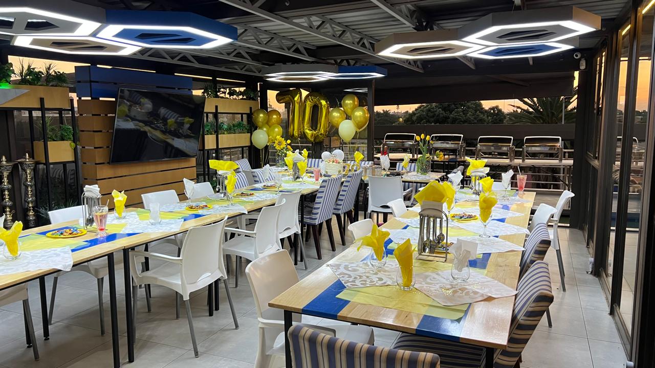 70th birthday setup — yellow decor